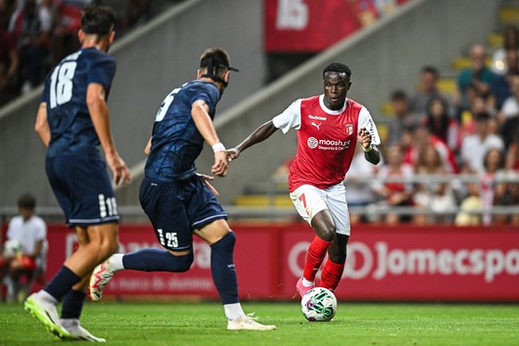 BRAGA, PORTUGAL - AUGUST 8: Bruma of Sporting Braga and Mateja Djordjevic of TSC Backa Topola in action during the UEFA Champions League Third Qualifying Round: First Leg match between Sporting Braga  ...