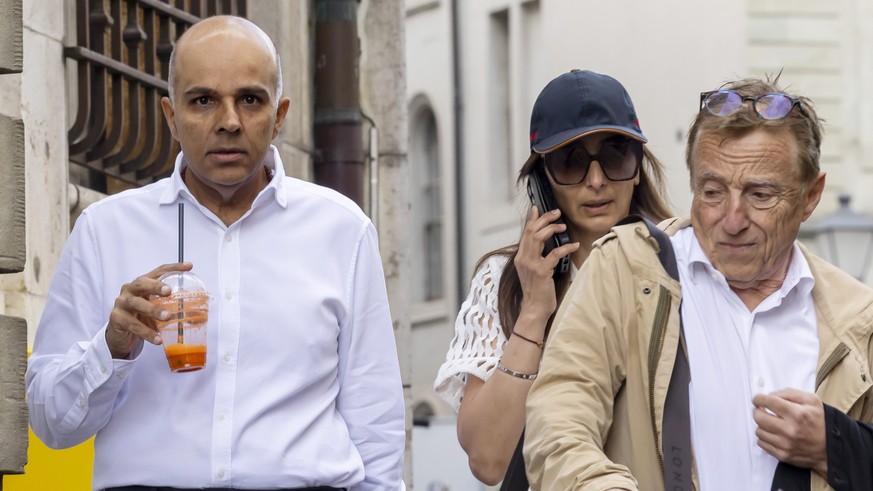 epa11401662 Ajay Hinduja (L) and his wife Namrata arrive with their lawyer Robert Assael at the court house for the resumption day of the trial against members of Indian billionaire family Hinduja, ch ...