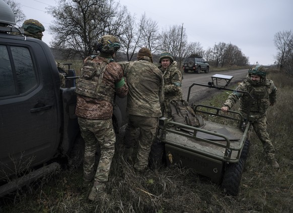 epa12519769 A handout photo made available by the press service of the 93rd Kholodnyi Yar Separate Mechanised Brigade of Ukrainian Armed Forces on 12 November 2025 shows servicemen of the 93rd Kholodn ...