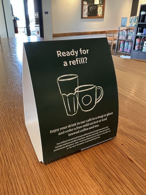 Tabletop sign advertising free coffee and tea refills inside a Starbucks at Pleasant Hill Plaza, Pleasant Hill, California, February 18, 2025. (Photo by Smith Collection/Gado/Getty Images)