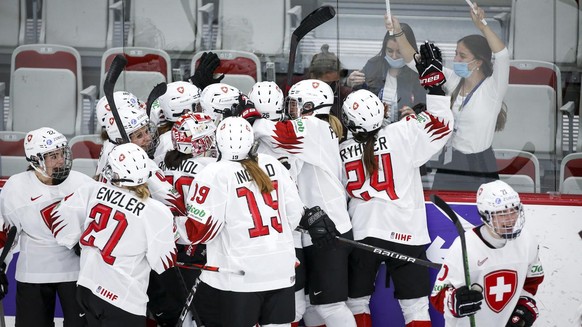 Switzerland celebrate after defeating Russian Olympic Committee during overtime quarterfinal IIHF Women&#039;s World Championship hockey game in Calgary, Alta., Saturday, Aug. 28, 2021. (Jeff McIntosh ...
