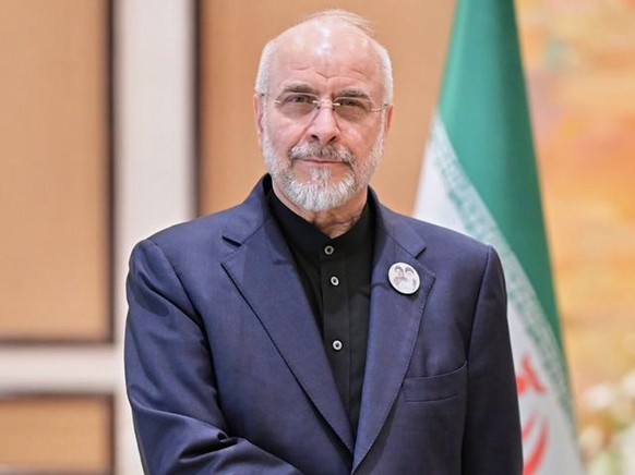 In this photo released by the Pakistan Prime Minister Office, Iran's Parliament Speaker Mohammad Bagher Ghalibaf, left, shakes hand with Pakistani Prime Minister Shehbaz Sharif prior to their mee ...