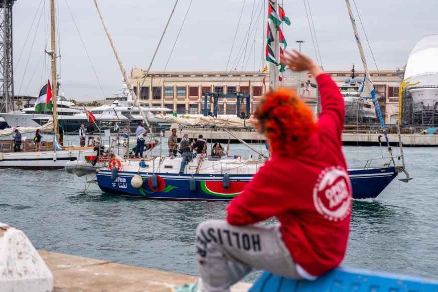 Boats carrying activists and humanitarian aid for Palestinians in Gaza reposition in the port during a symbolic send-off as part of the Global Sumud Flotilla, in Barcelona, Spain, Sunday, April 12, 20 ...