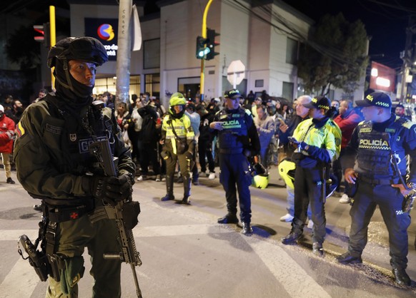 Police stand guard outside the Medicentro hospital where Colombian senator and presidential candidate Miguel Uribe Turbay is being treated after he was shot during a campaign rally in Bogota, Colombia ...