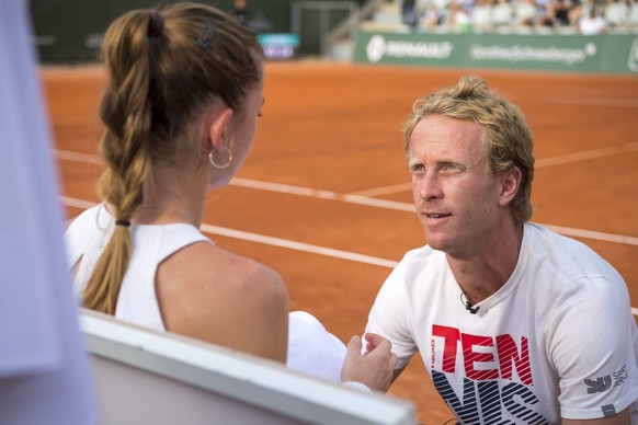 Simona Waltert from Switzerland talks with the coach Stephane Bohli during the second round match, at the WTA International Ladies Open Lausanne tournament in Lausanne, Switzerland, Thursday, July 18, ...