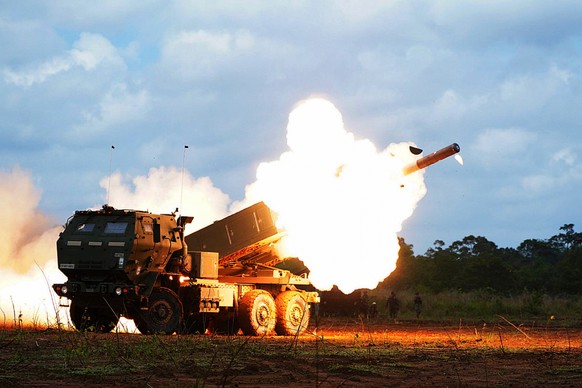 In this photo released by Indonesian Armed Forces information Center (Puspen TNI), on Wednesday, Sept. 3, 2025, a rocket is launched from a US Army's High Mobility Artillery Rocket System (HIMARS ...