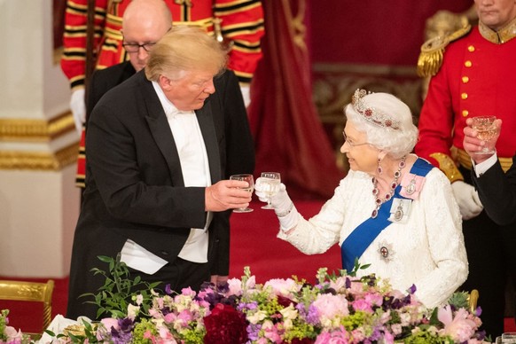 LONDON, ENGLAND - JUNE 03: U.S. President Donald Trump and Queen Elizabeth II make a toast during a State Banquet at Buckingham Palace on June 3, 2019 in London, England. President Trump&#039;s three- ...