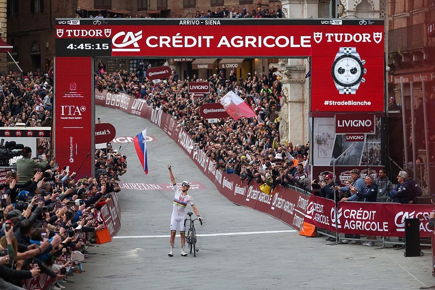 SIENA, ITALY - MARCH 07: Tadej Pogacar of Slovenia and UAE Team Emirates - XRG celebrates at finish line as race winner during the 20th Strade Bianche 2026 a 203km one day race from Siena to Siena on  ...
