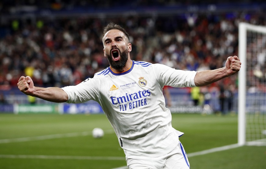 epa09983192 Dani Carvajal of Real Madrid celebrates his team's first goal during the UEFA Champions League final between Liverpool FC and Real Madrid at Stade de France in Saint-Denis, near Paris ...
