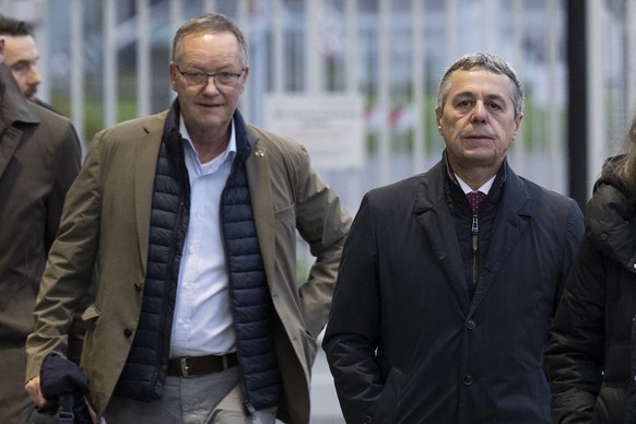 epa10590159 Swiss Federal Councilor Ignazio Cassis (R) and Christian Winter (L), Swiss Ambassador of Sudan, arrive during a press conference at the Bern-Belp Airport in Belp, Switzerland, 25 April 202 ...