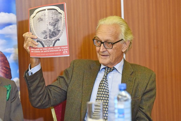(170331)--NAIROBI, March 31, 2017-- Iain Douglas Hamilton, Founder of Save the Elephants, a conservation organization, displays a report on China s legal ivory trade in Nairobi, Kenya, March 29, 2017. ...
