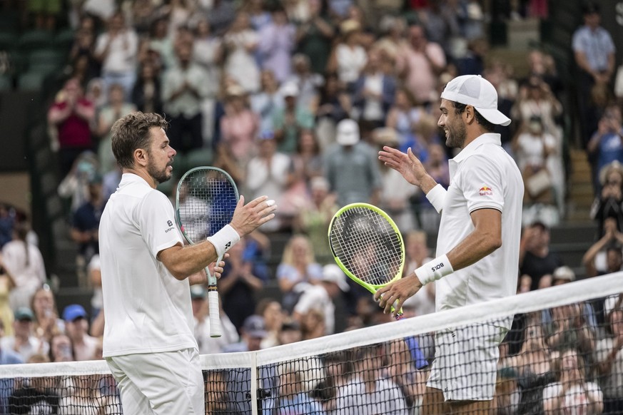Stan Wawrinka of Switzerland, left, congratulates Matteo Berrettini of Italy who defeated him in their first round match at the Wimbledon All England Lawn Tennis Championships AELTC in London, on Tues ...