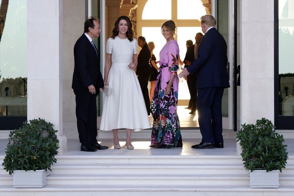 PALM BEACH, FLORIDA - APRIL 06: Republican presidential candidate and former US President Donald Trump (R) and former first lady Melania Trump (2nd-R) arrive at the home of John Paulson (L) with Alina ...