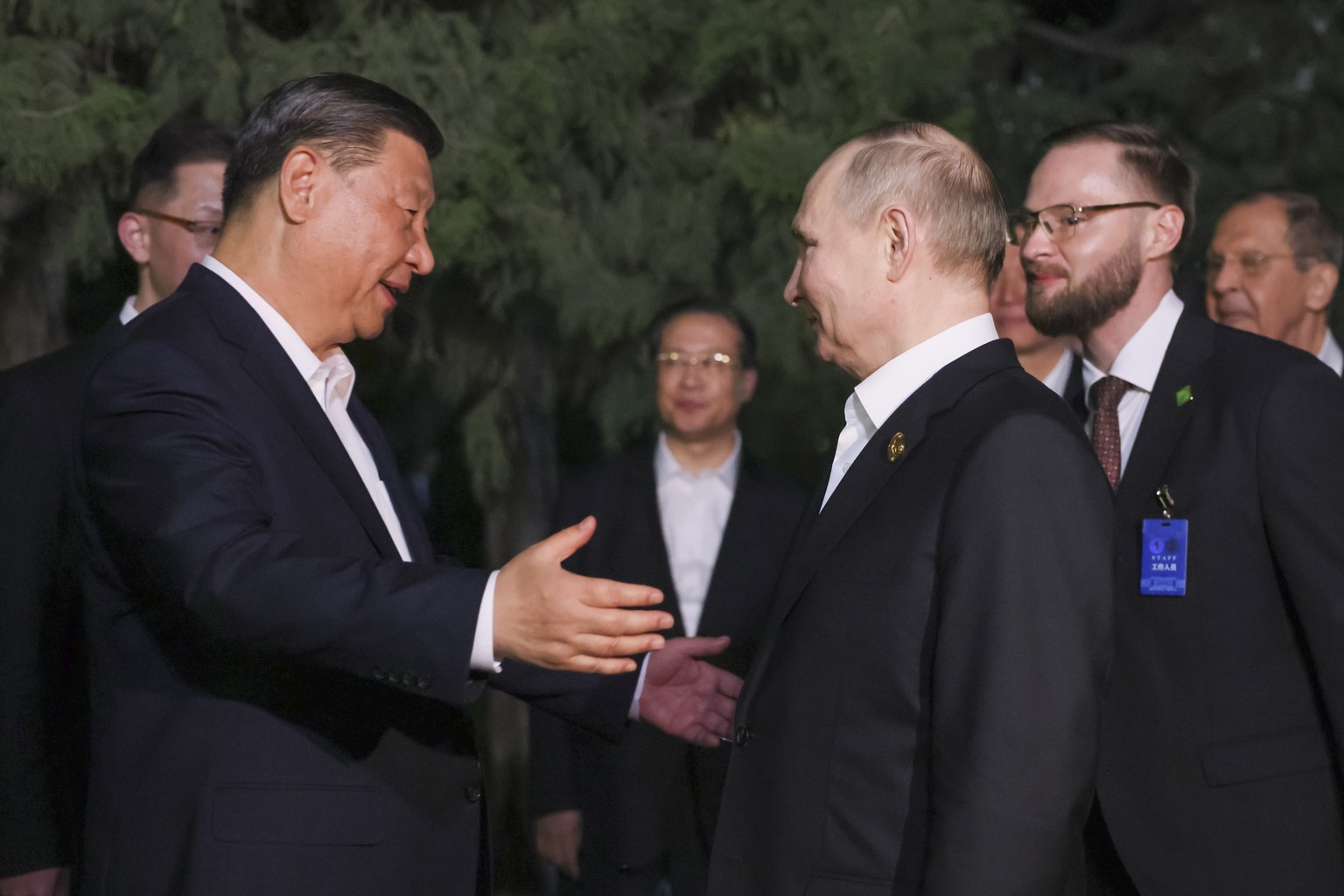 Chinese President Xi Jinping, left, gestures while speaking to Russian President Vladimir Putin after an informal meeting in Beijing, China, on Thursday, May 16, 2024. (Mikhail Metzel, Sputnik, Kremli ...