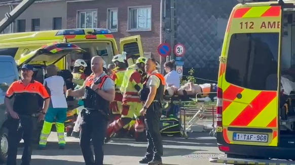 This video grab shows rescue workers on the scene of a crash between a train and vehicle in Buggenhout, Belgium, Tuesday, May 26, 2026. (VTM via AP)
Belgium Crash