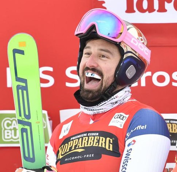 Winner Regez Ryan of Switzerland, center, second placed Terence Tchiknavorian of France, left, and third placed Adam Kappacher of Austria celebrate after the men&#039;s big final during the FIS Freest ...