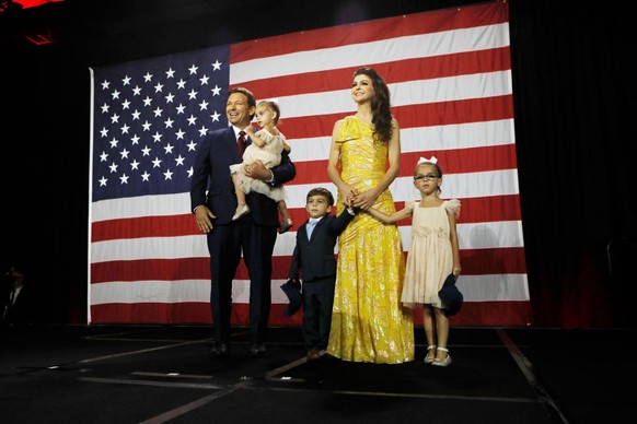 TAMPA, FL - NOVEMBER 08: Florida Gov. Ron DeSantis, his wife Casey DeSantis and their children walk on stage to celebrate victory over Democratic gubernatorial candidate Rep. Charlie Crist during an e ...