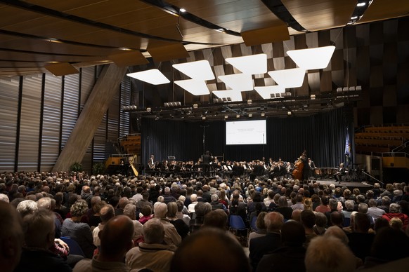 epa12963675 Members of the Societe de musique La Gerinia Marly perform with Swiss conductor Laurent Zufferey in the congress center during the Swiss National Music Festival 2026 in Biel/Bienne, Switze ...