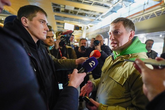 epa10445921 Wagner group mercenary Andrey Medvedev (L) meets with Russian human rights activist, founder of gulagu.net Vladimir Osechkin (R) at Gardermoen, Norway, 03 February 2023. Medvedev who serve ...