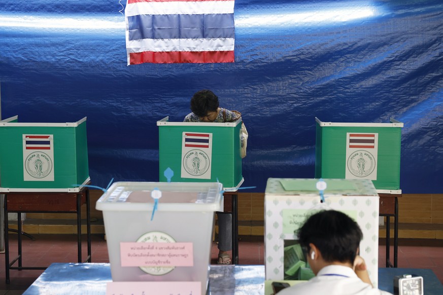 epa12715136 A voter prepares their ballot during the general election at a polling station in Bangkok, Thailand, 08 February 2026. According to the Election Commission of Thailand (ECT), 52.9 million  ...