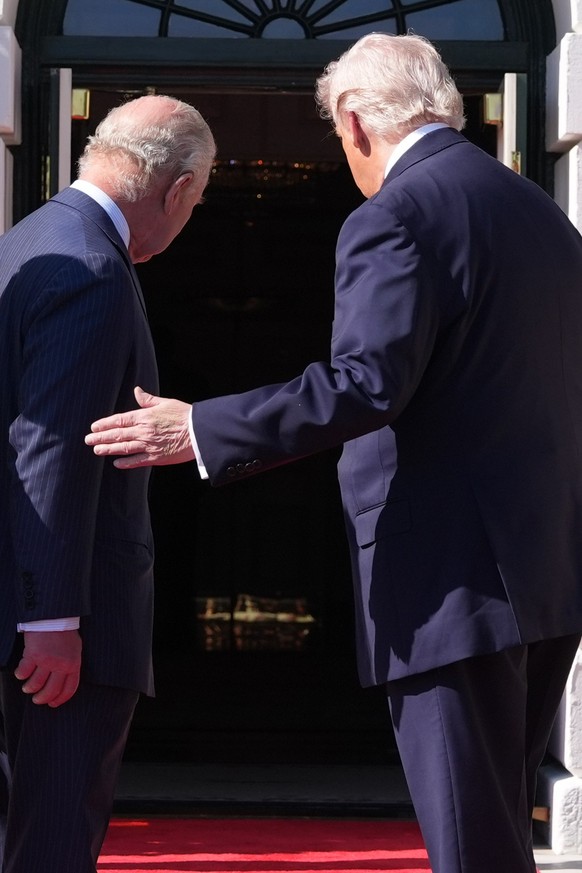 President Donald Trump and Britain's King Charles III turn to walk into the White House, Monday, April 27, 2026, in Washington. (AP Photo/Alex Brandon)