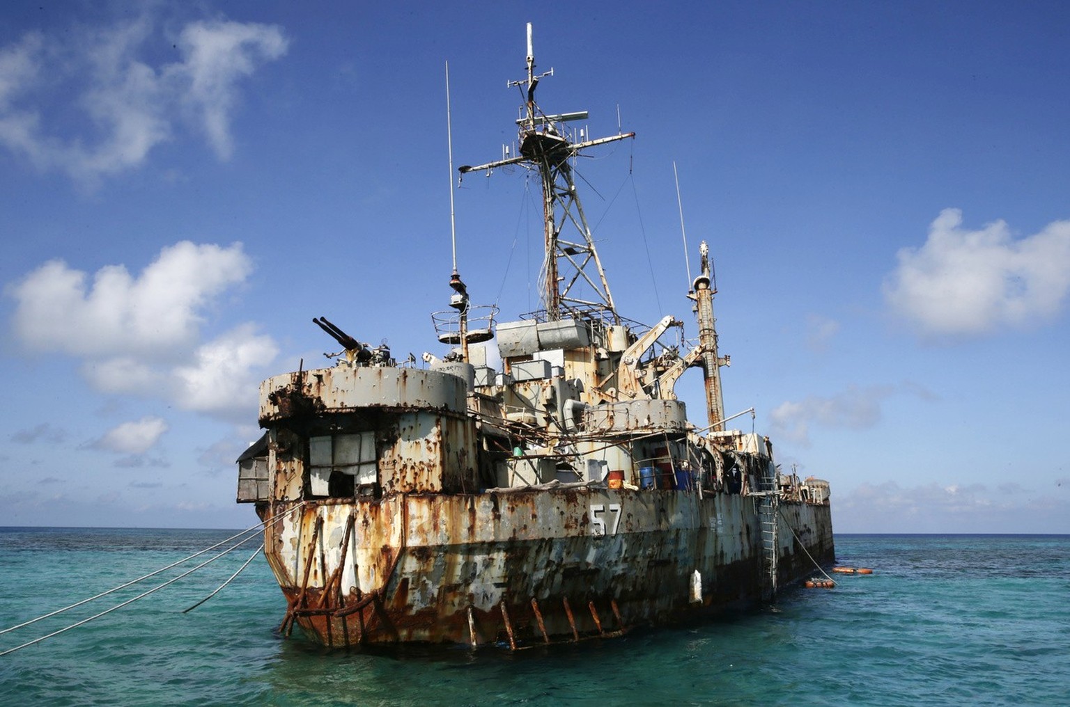 FILE - In this March 30, 2014, file photo, the dilapidated Philippine Navy ship LT 57 Sierra Madre is in the shallow waters of Second Thomas Shoal in the South China Sea. In one of the world&#039;s mo ...