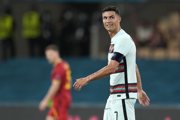 epa09306872 Portugal&#039;s player Cristiano Ronaldo reacts at the end of the UEFA EURO 2020 round of 16 soccer match between Belgium and Portugal held at La Cartuja Sevilla stadium, in Seville, Spain ...