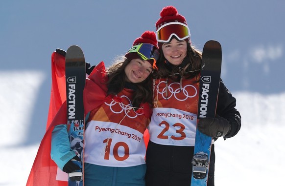 epa06535144 Silver medalist Mathilde Gremaud of Switzerland (R) and Gold medalist Sarah Hoefflin of Switzerland (L) react during the venue ceremony for the Women&#039;s Freestyle Skiing Ski Slopestyle ...
