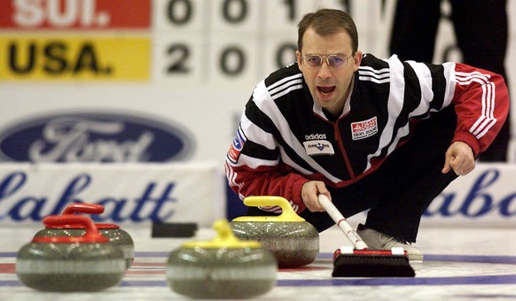 Switzerland&#039; skip Patrick Huerlimann guides his team&#039;s rock into a crowded house on the way to defeating the U.S. in the men&#039;s bronze medal game at the World Curling Championships in Sa ...