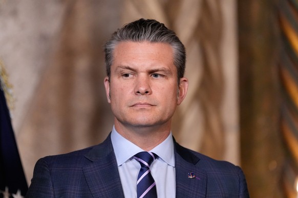 Defense Secretary Pete Hegseth listens as President Donald Trump speaks at his Mar-a-Lago club, Monday, Dec. 22, 2025, in Palm Beach, Fla. (AP Photo/Alex Brandon)
Pete Hegseth