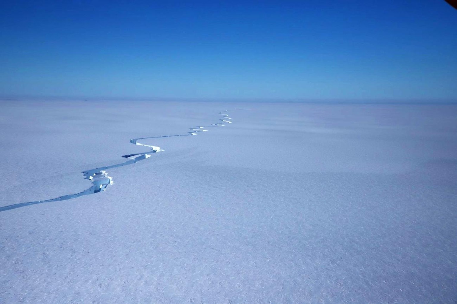 epa09044807 A handout photo made available by the British Antarctic Survey (BAS) shows a crack in the Brunt Ice Shelf during flyover on 12 January 2021 (issued 01 March 2021). An iceberg of approximat ...