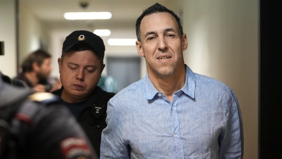 French citizen Laurent Vinatier is escorted to a court room at the Zamoskvoretsky District Court in Moscow, Russia, on Monday, Oct. 14, 2024. (AP Photo/Pavel Bednyakov)