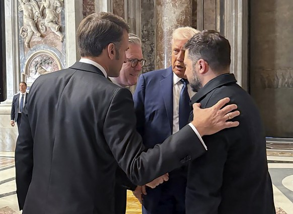 epa12056122 epa12056109 A handout photo made available by the Ukrainian Presidential Press Service shows (L-R) French President Emmanuel Macron, British Prime Minister Keir Starmer, US President Donal ...