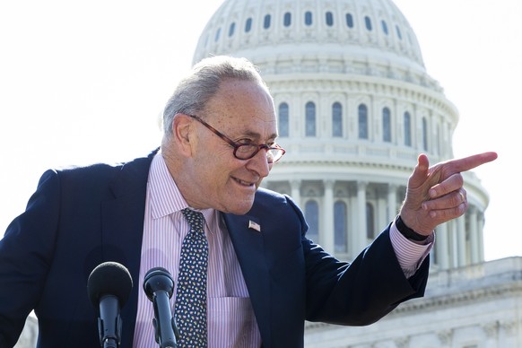 epa09066340 Senate Majority Leader Chuck Schumer attends a news conference during the House vote on the American Rescue Plan, at the East Front of the US Capitol in Washington, DC, USA, 10 March 2021. ...