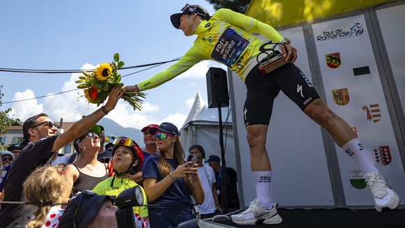 epa12306378 The winner of The Tour de Romandie Feminin Elise Chabbey from Switzerland of team FDJ - Suez, celebrates on the podium during the third and last stage, a 122,1 km race around Aigle at the  ...