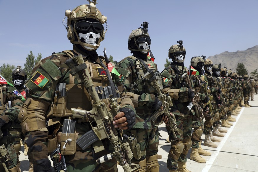 Newly Afghan Army Special forces attend their graduation ceremony after a three-month training program at the Kabul Military Training Centre (KMTC) in Kabul, Afghanistan, Saturday, July 17, 2021. (AP  ...