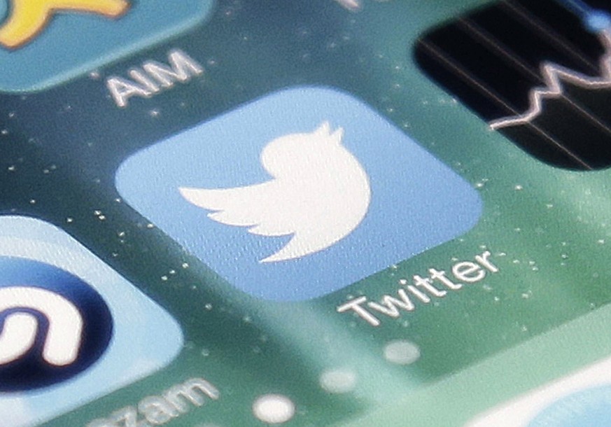FILE - This Nov. 4, 2013, file photo shows the icon for the Twitter app on an iPhone in San Jose, Calif. Twitter, in a call with executives Thursday, July 7, 2022, said it removes 1 million spam accou ...