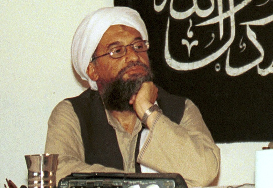 FILE - In this 1998 file photo made available Friday, March 19, 2004, Ayman al-Zawahri, holds a press conference with Osama bin Laden (not seen) in Khost, Afghanistan. Ayman al-Zawahri made an appeara ...