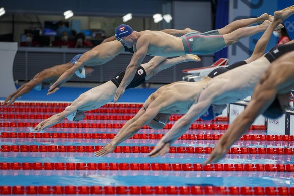 epa09362379 Bernhard Reitshammer of Austria competes in the men&#039;s 100m Breaststroke Heats during the Swimming events of the Tokyo 2020 Olympic Games at the Tokyo Aquatics Centre in Tokyo, Japan,  ...