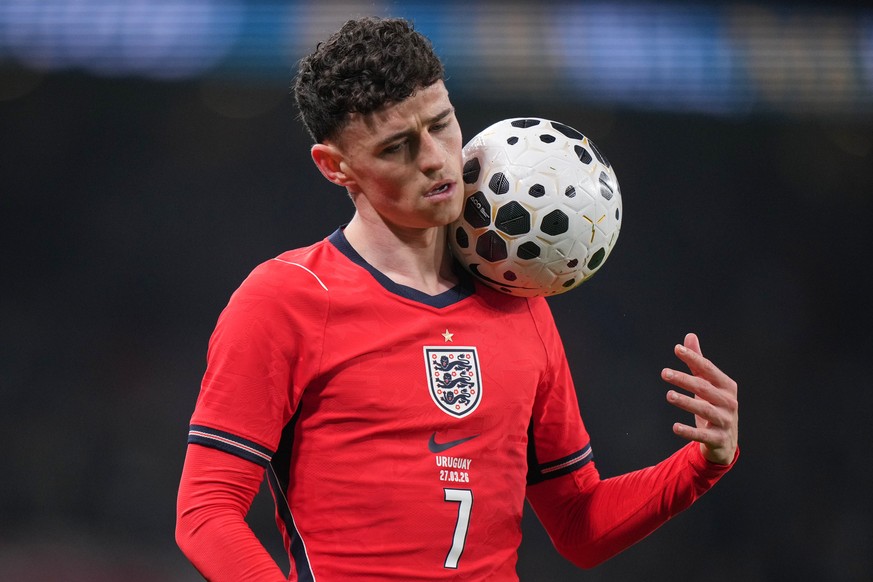 England's Phil Foden holds the ball during the international friendly soccer match between England and Uruguay in London, Friday, March 27, 2026. (AP Photo/Alastair Grant)
Phil Foden
