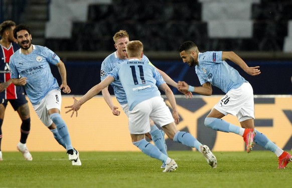 epa09166073 Manchester City&#039;s Riyad Mahrez (R) celebrates with teammates after scoring his side&#039;s second goal during the UEFA Champions League semi final, first leg soccer match between PSG  ...