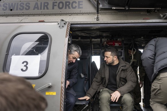 Switzerland&#039;s Foreign Minister Federal Councillor Ignazio Cassis, left, and his State guest Volodymyr Zelenskyy, President of Ukraine, right, get ready for takeoff in a Super Puma Helicopter of t ...