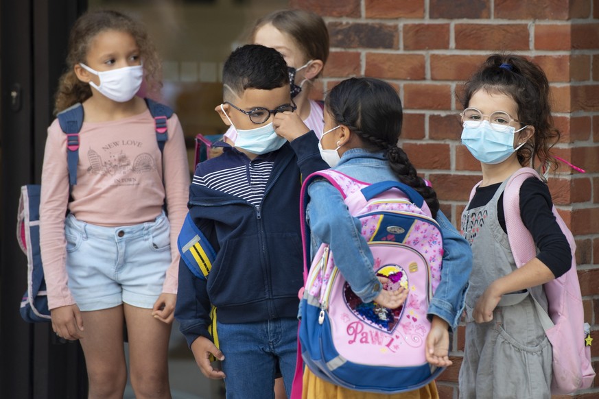 epa09442343 Childrens arrive for the first day of school after the summer holidays at the primary school in Bordeaux, France, 02 September 2021. More than 12.26 million students from kindergarten to h ...