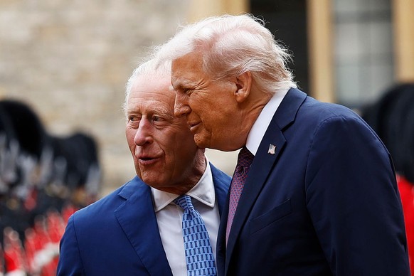 WINDSOR, ENGLAND - SEPTEMBER 17: King Charles III and US President Donald Trump inspect the Guard of Honour during the State visit by the President of the United States of America at Windsor Castle on ...