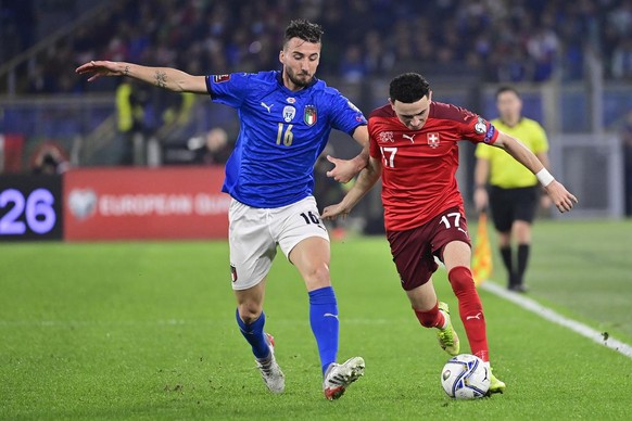 Italy&#039;s midfielder Bryan Cristante, left, fights for the ball against Switzerland&#039;s midfielder Ruben Vargas, right, during the 2022 FIFA World Cup European Qualifying Group C match between I ...