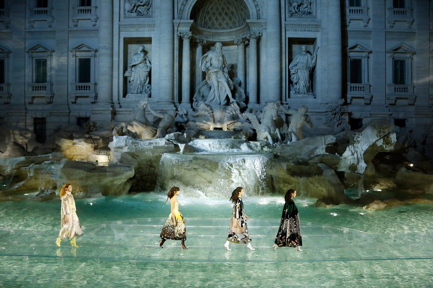 Models walk the runway at Fendi Roma 90 Years Anniversary fashion show at Fontana di Trevi on July 7, 2016 in Rome, Italy.