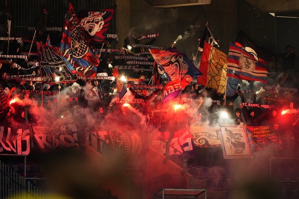 epa10106153 Basel fans light flares during the UEFA Europa Conference League third qualifying round, first leg soccer match between Brondby IF and FC Basel in Brondby, Denmark, 04 August 2022. EPA/Cla ...