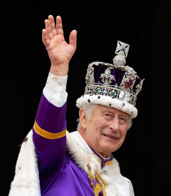 LONDON, ENGLAND - MAY 06: King Charles III on the balcony of Buckingham Palace following the Coronation of King Charles III and Queen Camilla on May 06, 2023 in London, England. The Coronation of Char ...