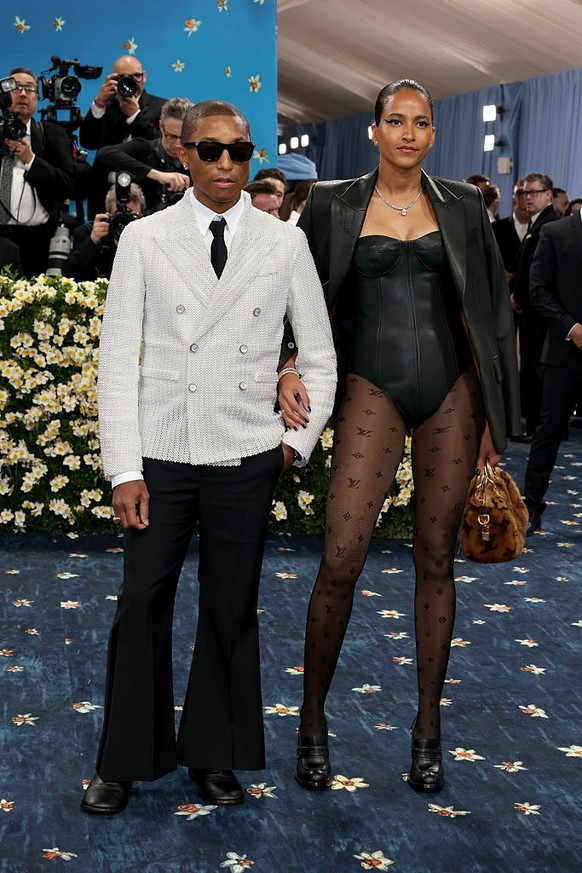 NEW YORK, NEW YORK - MAY 05: (L-R) Pharrell Williams and Helen Lasichanh attend the 2025 Met Gala Celebrating "Superfine: Tailoring Black Style" at Metropolitan Museum of Art on May 05, 2025 ...