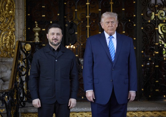 epa12616354 A handout photo made available by the Presidential Press Service shows US President Donald Trump (R) meeting with Ukrainian President Volodymyr Zelensky (L) in Florida, USA, 28 December 20 ...